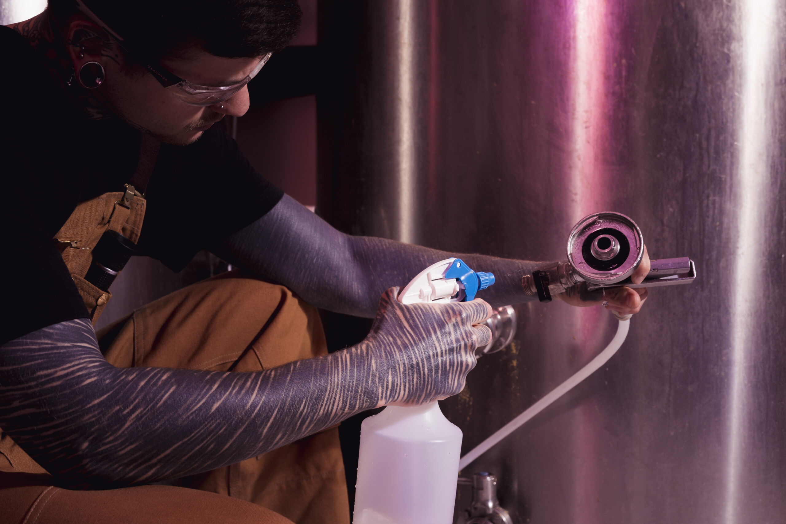 man-with-tattoos-producing-craft-beer